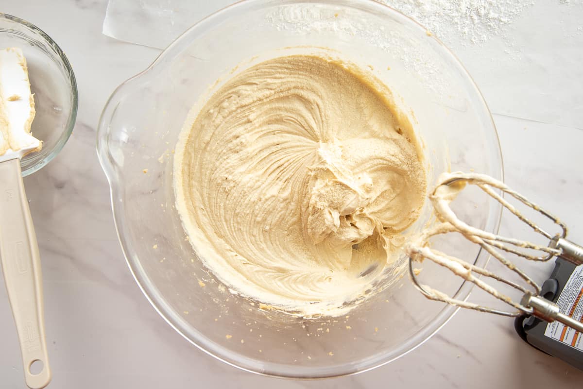The batter is mixed in a clear glass mixing bowl.