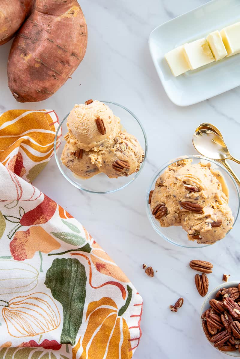 Two dessert goblets filled with scoops of Sweet Potato Butter Pecan Frozen Custard