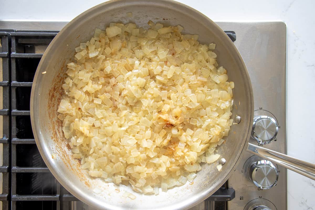The onions are cooked until golden in a sauté pan.