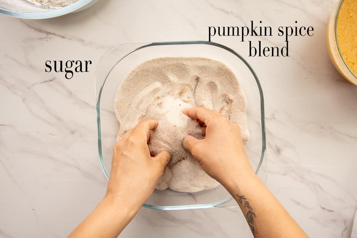 The sugar and pumpkin spice blend are combined by hand.
