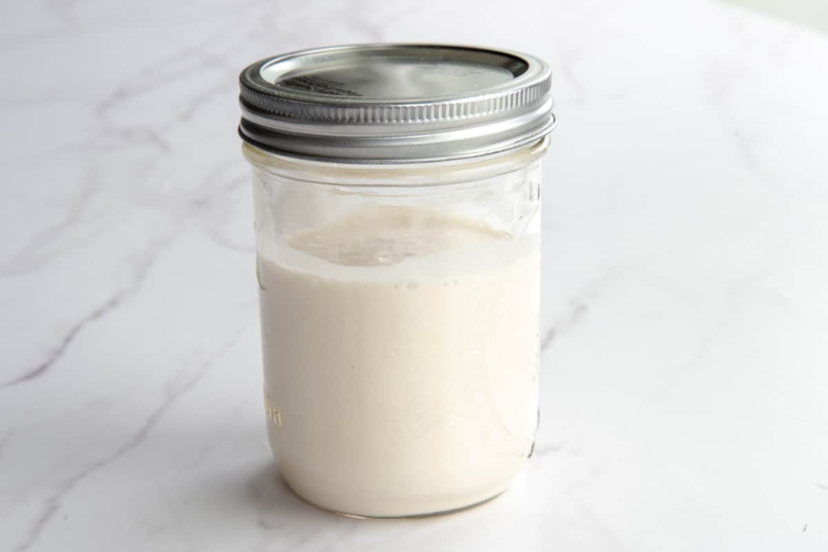 The Sourdough Starter ready to use in a glass mason jar.