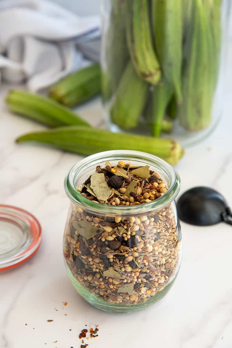 A clear glass jar filled with Flavorful Pickling Spice.