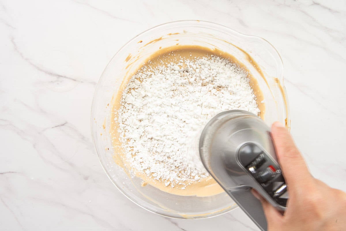 Cornstarch is blended into the batter with an electric hand mixer.