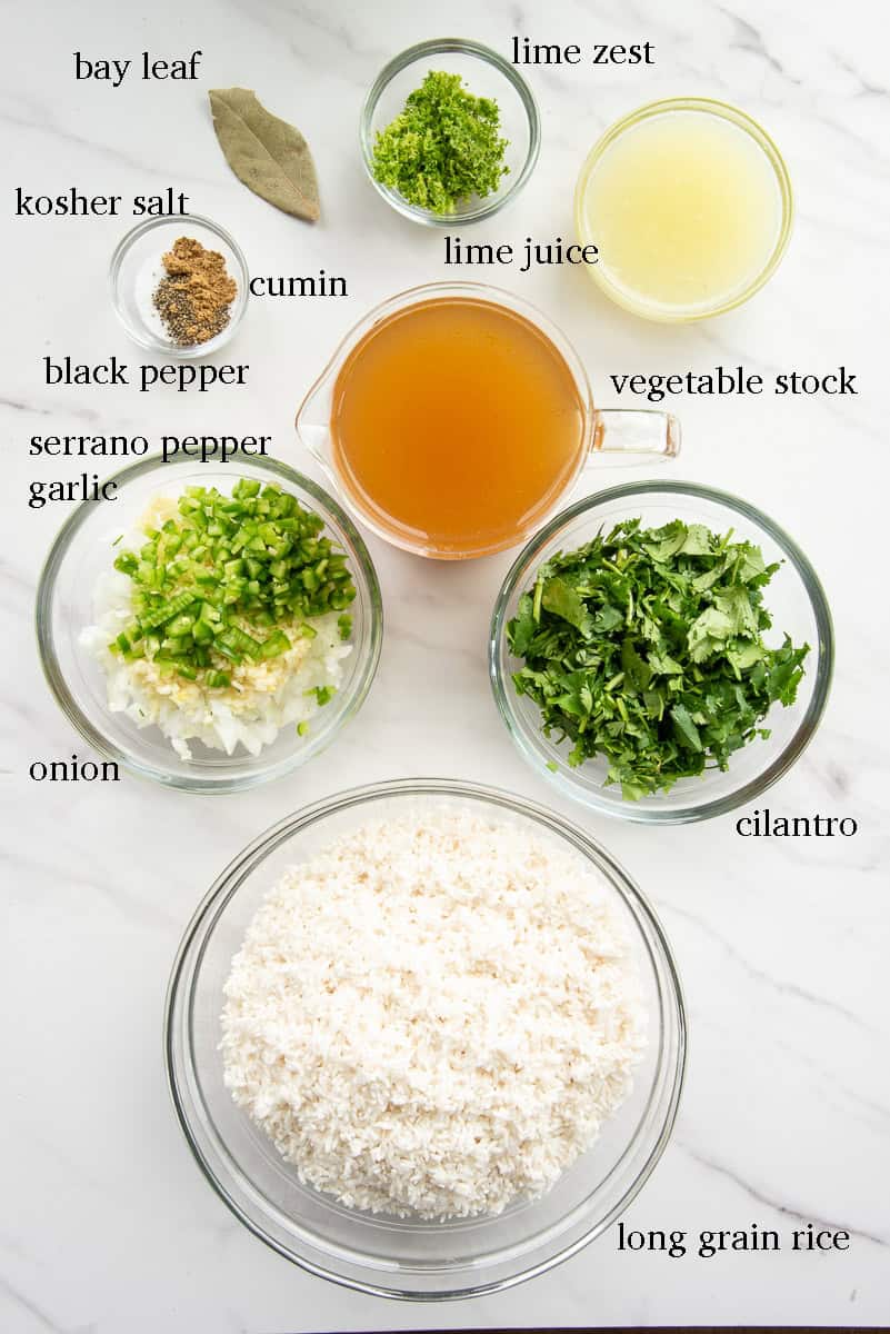 The ingredients needed to make the recipe are on a white countertop and labeled with black text.