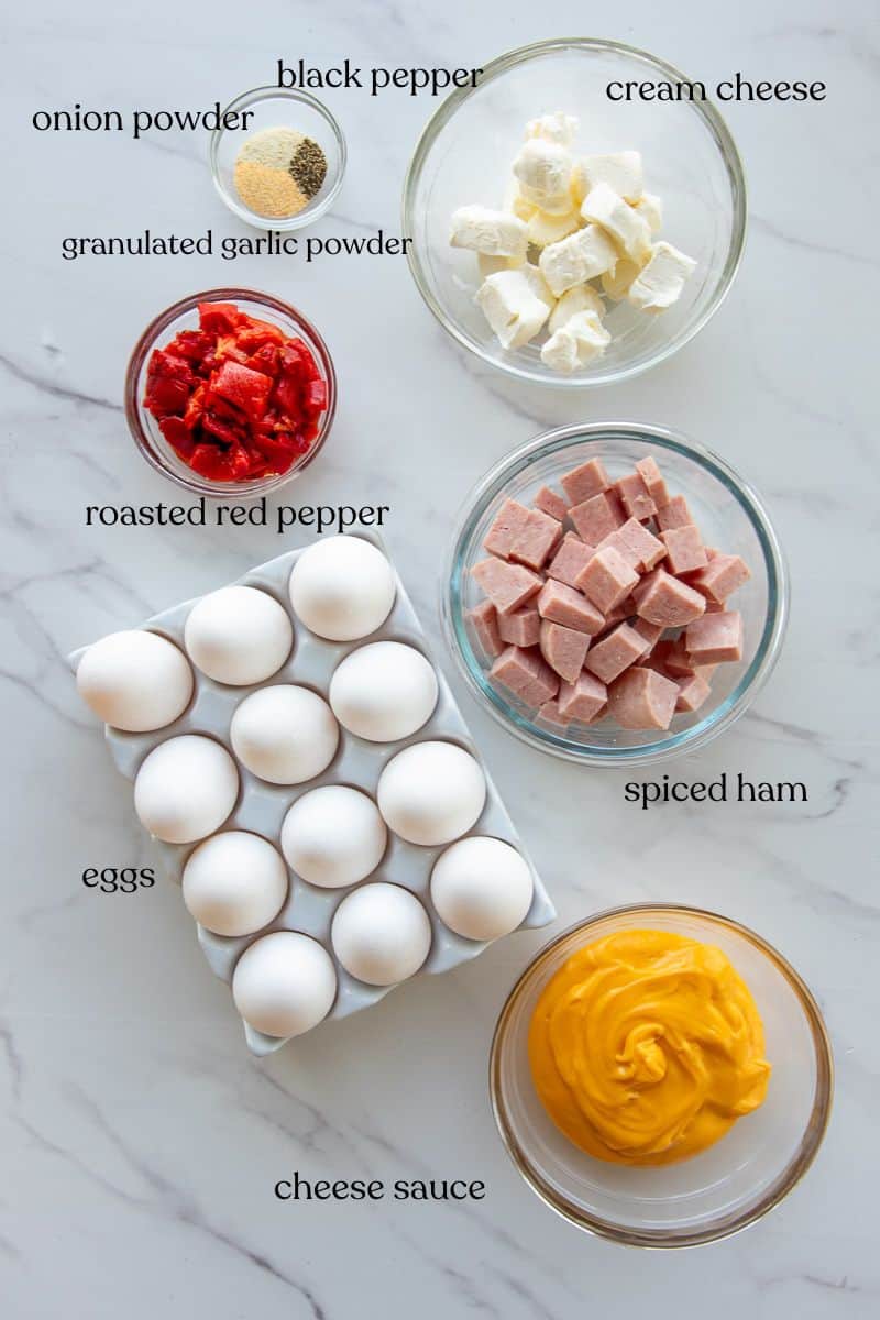 The ingredients needed to make the recipe are on a marble surface and labeled with black text.