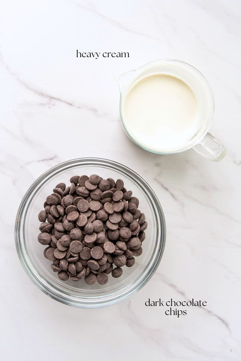 The ingredients needed to make the chocolate ganache are labeled on the countertop.