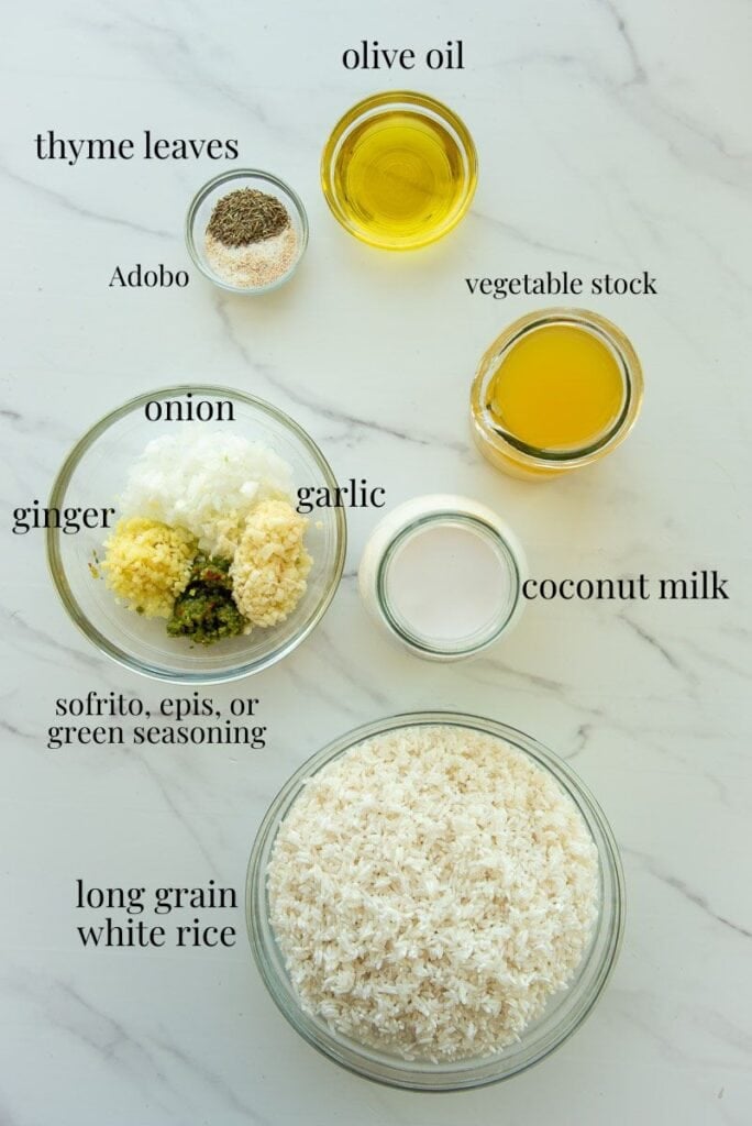 The labeled ingredients to make Caribbean Coconut Rice are on a white countertop.