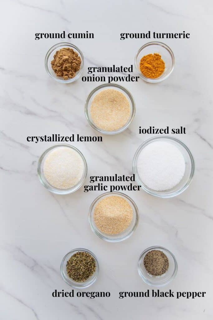 The ingredients needed to make the recipe are labeled and on a marble countertop.